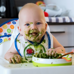 baby eating greens